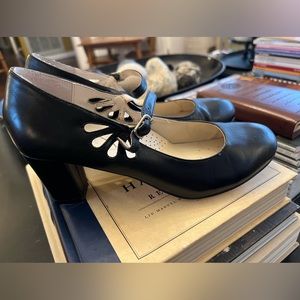 Black pumps with adjustable straps by Fitzwell